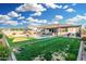 Expansive backyard with pool, putting green, gazebo, and covered patio at 2052 E Scorpio Pl, Chandler, AZ 85249