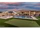 Enjoy outdoor living with a pool, spa, putting green, and covered patio, perfect for recreation and relaxation at 2052 E Scorpio Pl, Chandler, AZ 85249