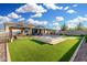 Beautiful backyard featuring a pool, gazebo, putting green, and lush artificial turf at 2052 E Scorpio Pl, Chandler, AZ 85249