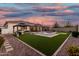 Expansive backyard with a pool, spa, putting green, and covered patio, ideal for outdoor enjoyment and entertaining at 2052 E Scorpio Pl, Chandler, AZ 85249