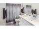 Bathroom with modern gray shower curtain and silver hardware accents at 2052 E Scorpio Pl, Chandler, AZ 85249