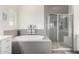 A view of the soaking tub with a glass enclosed shower in the background at 2052 E Scorpio Pl, Chandler, AZ 85249