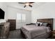 Bedroom featuring wood furniture with gray bedding and accent pillows at 2052 E Scorpio Pl, Chandler, AZ 85249