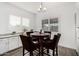 Bright breakfast nook features a round table with seating for four and sunny window at 2052 E Scorpio Pl, Chandler, AZ 85249