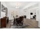 Elegant dining room with decorative windows and a modern chandelier at 2052 E Scorpio Pl, Chandler, AZ 85249