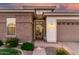 Inviting front entrance featuring a custom iron gate and manicured landscaping at 2052 E Scorpio Pl, Chandler, AZ 85249