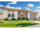 Inviting single-story home with lush lawn and well-maintained landscaping at 2052 E Scorpio Pl, Chandler, AZ 85249