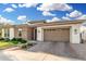 Beautiful single-story home featuring a brick facade and an attached two-car garage at 2052 E Scorpio Pl, Chandler, AZ 85249