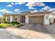 Attractive single-story home with a brick-accented exterior and a two-car garage at 2052 E Scorpio Pl, Chandler, AZ 85249