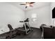 This home gym features a treadmill, weights, and fitness equipment at 2052 E Scorpio Pl, Chandler, AZ 85249