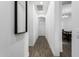 Hallway with wood-look floors, bright white walls and access to the dining room at 2052 E Scorpio Pl, Chandler, AZ 85249
