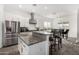 Kitchen includes stainless steel appliances, granite countertops, and a breakfast bar at 2052 E Scorpio Pl, Chandler, AZ 85249