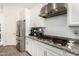 Kitchen with stainless steel appliances, granite countertops, and white cabinetry at 2052 E Scorpio Pl, Chandler, AZ 85249