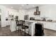 Kitchen boasts stainless steel appliances, granite countertops, and recessed lighting at 2052 E Scorpio Pl, Chandler, AZ 85249