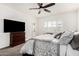 Comfortable main bedroom featuring large bed, ceiling fan and neutral tones at 2052 E Scorpio Pl, Chandler, AZ 85249