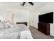 Inviting main bedroom with ceiling fan and en-suite bathroom access at 2052 E Scorpio Pl, Chandler, AZ 85249