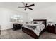 Cozy main bedroom with ceiling fan, window with shutters, and neutral decor at 2052 E Scorpio Pl, Chandler, AZ 85249