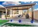 Covered patio with BBQ area, outdoor seating and string lights at 2052 E Scorpio Pl, Chandler, AZ 85249