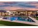 Sparkling pool with a spa, covered patio, and outdoor seating creates a relaxing backyard oasis for leisure and fun at 2052 E Scorpio Pl, Chandler, AZ 85249
