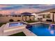 Stunning pool and spa with inviting patio area with lounge seating and dining area for relaxation and entertainment at 2052 E Scorpio Pl, Chandler, AZ 85249