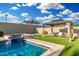Relaxing pool area with water feature, turf, umbrella, and shaded gazebo at 2052 E Scorpio Pl, Chandler, AZ 85249