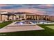 Relaxing backyard featuring a pool, spa, outdoor seating, and covered patio for comfortable outdoor living and entertaining at 2052 E Scorpio Pl, Chandler, AZ 85249