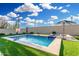 Inviting pool area with integrated spa, basketball hoop, and putting green at 2052 E Scorpio Pl, Chandler, AZ 85249