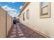 Side yard featuring walkway, gravel landscaping, and exterior of home at 2052 E Scorpio Pl, Chandler, AZ 85249