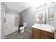 Bathroom featuring a shower-tub combo with playful curtain, single sink vanity, and neutral wall paint at 21754 W Pima St, Buckeye, AZ 85326