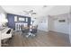Dining room with modern decor, including a dining table set, piano, and stylish lighting fixtures at 21754 W Pima St, Buckeye, AZ 85326