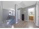 Upstairs hallway area with wood-look floors leading to rooms and multiple skylights at 21754 W Pima St, Buckeye, AZ 85326