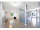 Open-concept living area featuring wood-look floors and plenty of natural light from the windows at 21754 W Pima St, Buckeye, AZ 85326