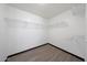 Spacious walk-in closet with wood-look flooring and multiple racks for organizing clothes and accessories at 21754 W Pima St, Buckeye, AZ 85326