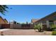 View of the backyard featuring block wall and desert landscaping at 21985 E Quintero Rd, Queen Creek, AZ 85142