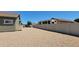 Spacious gravel backyard, featuring room for RV parking and additional vehicles behind a block wall at 21985 E Quintero Rd, Queen Creek, AZ 85142