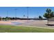 Outdoor basketball courts at Frontier Gathering Park, surrounded by green spaces and walking paths at 21985 E Quintero Rd, Queen Creek, AZ 85142