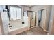 Beautiful bathroom boasts a soaking tub next to a shower with glass doors at 21985 E Quintero Rd, Queen Creek, AZ 85142