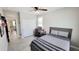 Cozy bedroom featuring tiled floor, window and ceiling fan at 21985 E Quintero Rd, Queen Creek, AZ 85142