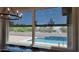 Dining area with a large window overlooking the backyard pool and outdoor living space at 21985 E Quintero Rd, Queen Creek, AZ 85142