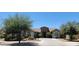 Charming single-story home with a desert landscape, neutral exterior, and a welcoming entrance at 21985 E Quintero Rd, Queen Creek, AZ 85142