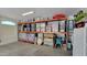 Organized garage storage with shelving units filled with storage containers at 21985 E Quintero Rd, Queen Creek, AZ 85142