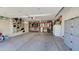 A spacious garage with storage shelves, tool rack and organized storage at 21985 E Quintero Rd, Queen Creek, AZ 85142