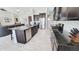 Modern kitchen with a large island, stainless steel appliances, and dark cabinets for a contemporary look at 21985 E Quintero Rd, Queen Creek, AZ 85142