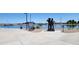 Scenic lake view featuring a statue and fountain, perfect for community enjoyment and relaxation at 21985 E Quintero Rd, Queen Creek, AZ 85142