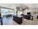 Open concept living space featuring a kitchen island, dining table, and comfortable seating area with tile floors at 21985 E Quintero Rd, Queen Creek, AZ 85142