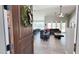 Bright, open-concept living room with modern tile floors, high ceilings, and access to the backyard at 21985 E Quintero Rd, Queen Creek, AZ 85142