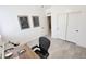 Office space features tile floors, desk and decorative artwork on the walls at 21985 E Quintero Rd, Queen Creek, AZ 85142