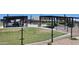 Shaded picnic areas and playgrounds at Frontier Gathering Park for community gatherings and outdoor fun at 21985 E Quintero Rd, Queen Creek, AZ 85142