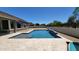 Sparkling pool featuring a waterfall feature and tanning ledge at 21985 E Quintero Rd, Queen Creek, AZ 85142