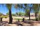 Scenic volleyball court surrounded by lush greenery and open spaces at Frontier Gathering Park at 21985 E Quintero Rd, Queen Creek, AZ 85142
